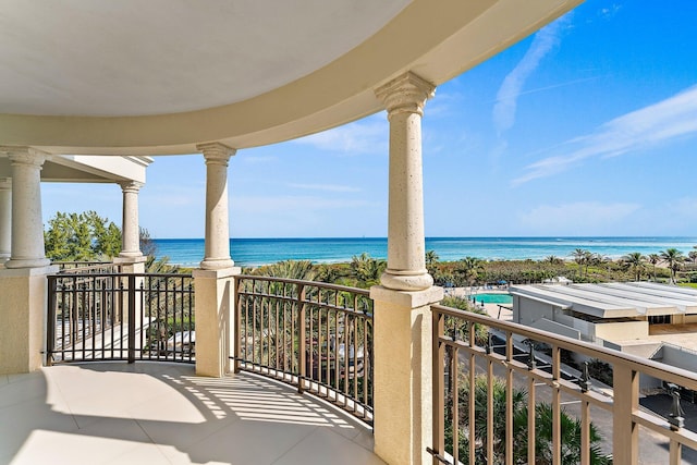 balcony featuring a water view