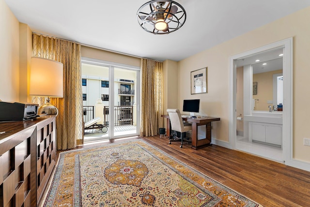 office space with ceiling fan and dark wood-type flooring