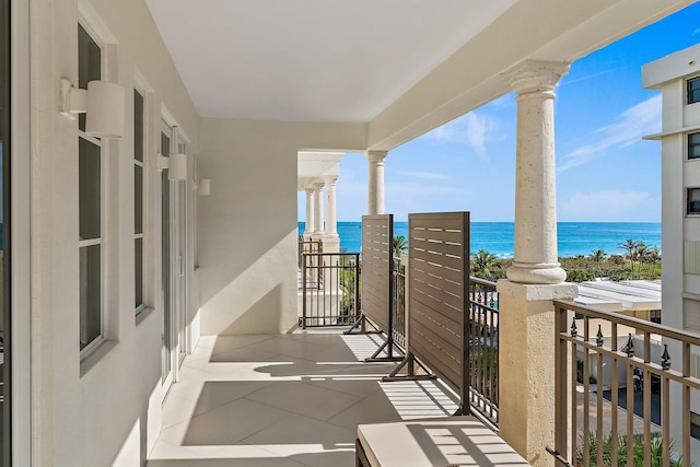 balcony featuring a water view