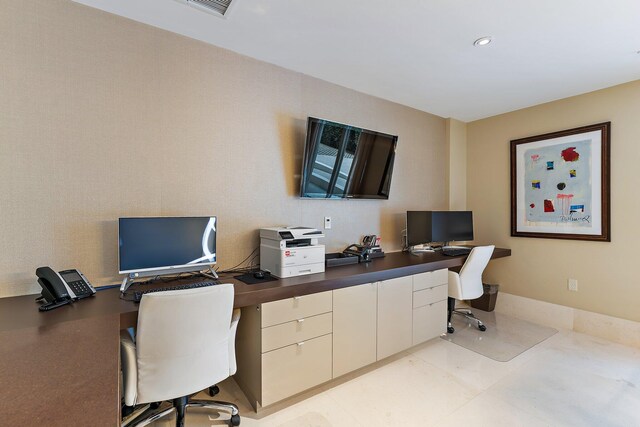 dining space with built in desk and light tile patterned floors