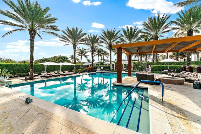 view of swimming pool with a pergola and a patio area