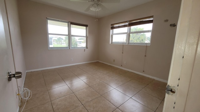 tiled empty room with ceiling fan