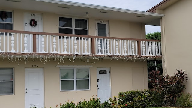 property entrance with a balcony