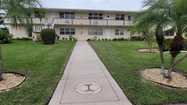 view of community featuring a lawn