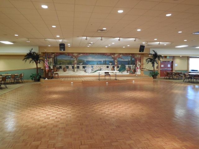 workout area featuring parquet flooring