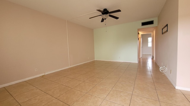 208 Easthampton I, West Palm Beach, FL 33417 - spare room featuring light tile patterned floors, a ceiling fan, and baseboards