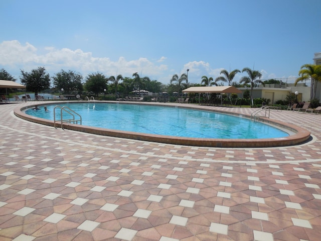 view of swimming pool with a patio area