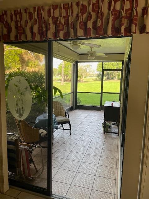 sunroom / solarium featuring a healthy amount of sunlight