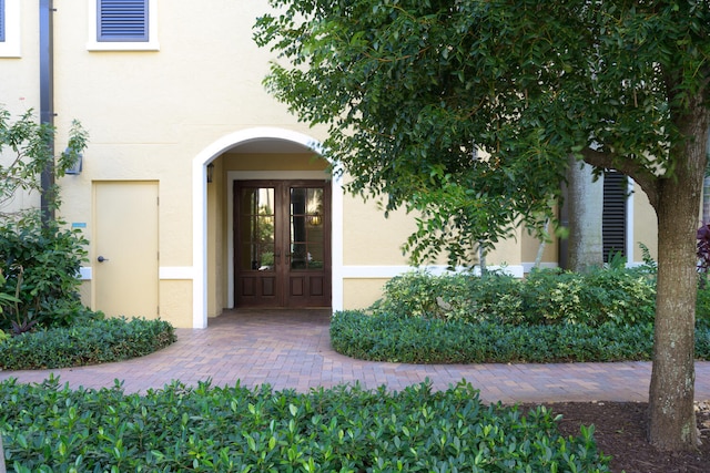 entrance to property featuring french doors