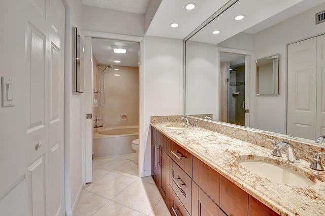 full bathroom featuring vanity, tile patterned floors, bathing tub / shower combination, and toilet