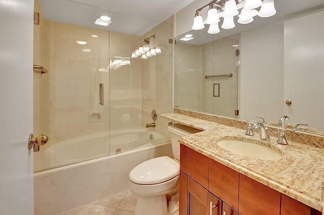 full bathroom featuring tile patterned flooring, vanity, shower / bath combination with glass door, and toilet