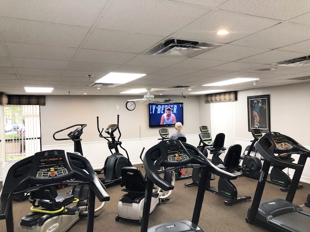 workout area featuring a paneled ceiling