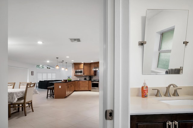 interior space with decorative backsplash and vanity