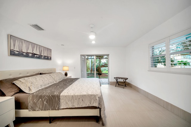 bedroom with ceiling fan and access to outside