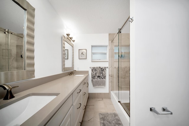 bathroom with a textured ceiling, vanity, and independent shower and bath