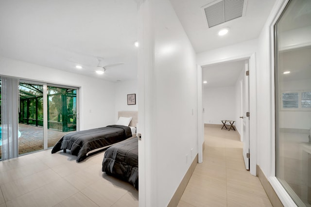 tiled bedroom with access to outside and ceiling fan