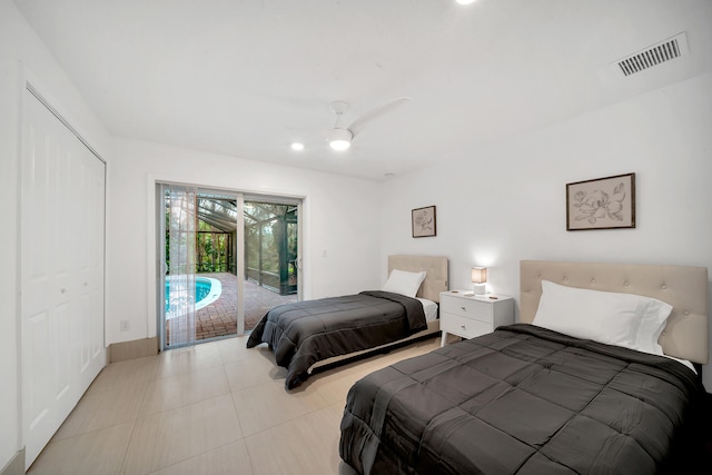 tiled bedroom with a closet, ceiling fan, and access to outside