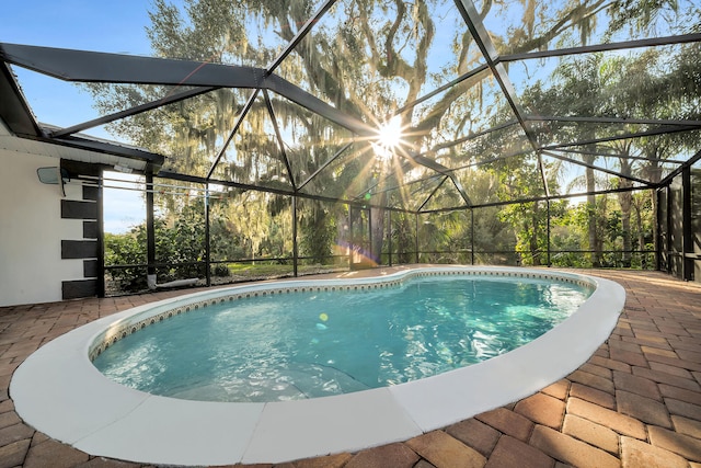 view of pool featuring a lanai and a patio area