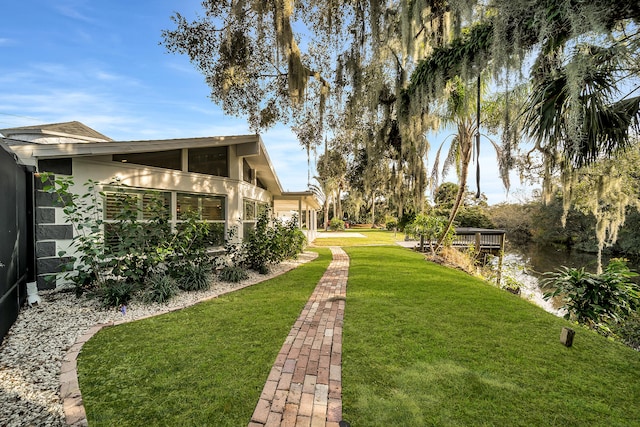 view of yard featuring a sunroom