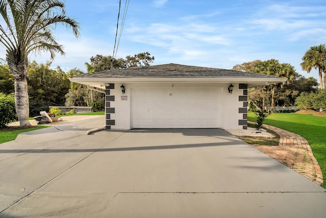 garage with a yard