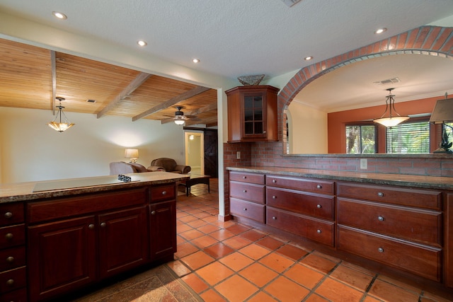 kitchen with ceiling fan, wooden ceiling, beamed ceiling, decorative light fixtures, and electric cooktop