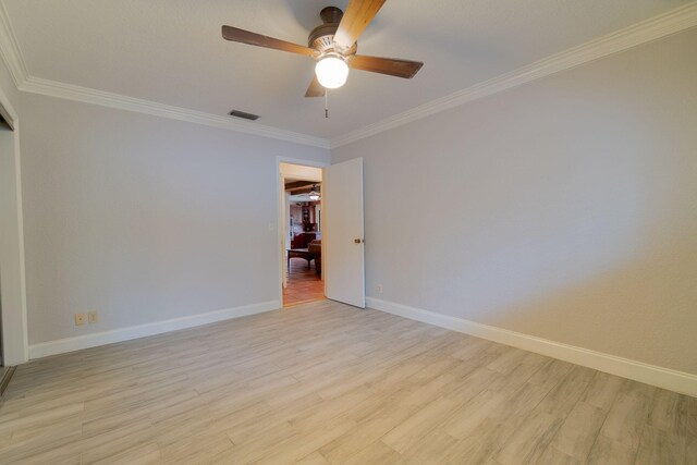 spare room with ceiling fan, light hardwood / wood-style floors, and ornamental molding