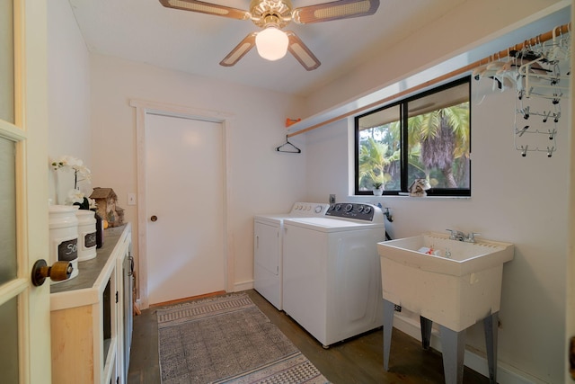 laundry area featuring wood finished floors, baseboards, washing machine and clothes dryer, laundry area, and ceiling fan