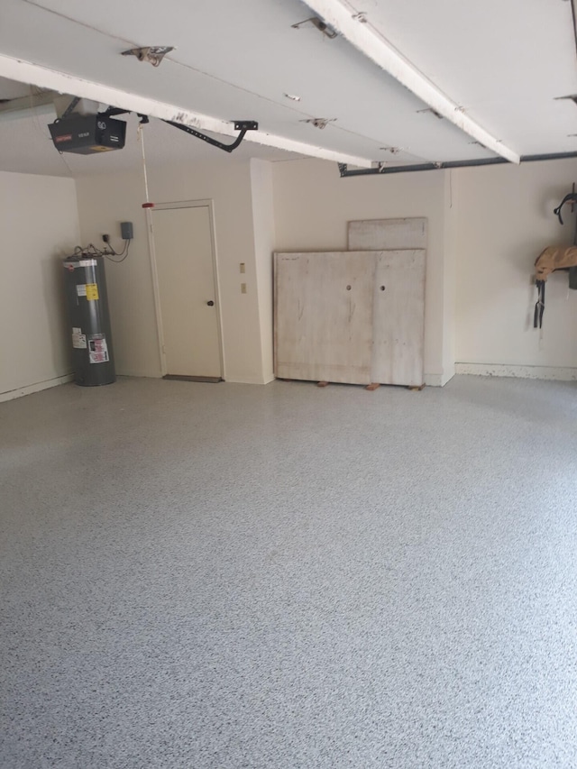 garage featuring electric water heater and a garage door opener