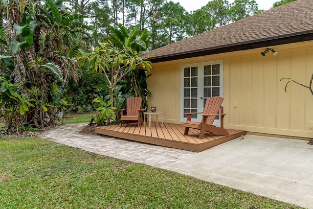 wooden terrace with a yard