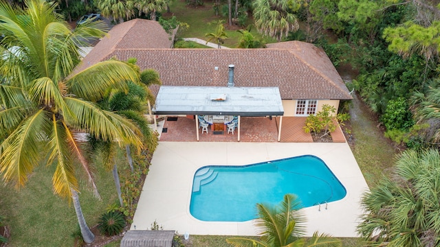 outdoor pool featuring a patio area