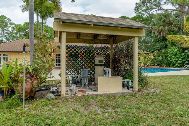 exterior space featuring a gazebo, an outdoor pool, and a patio