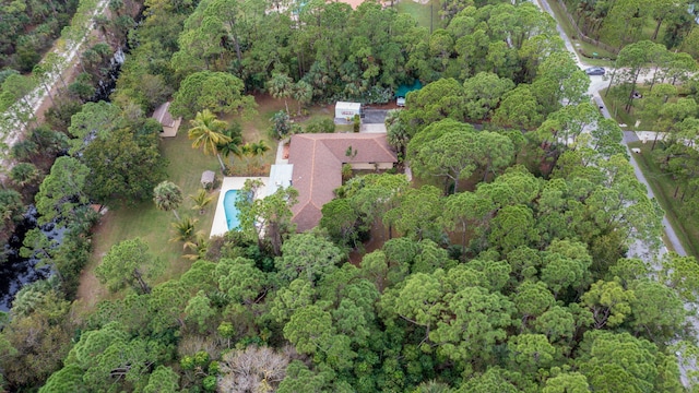 drone / aerial view with a view of trees