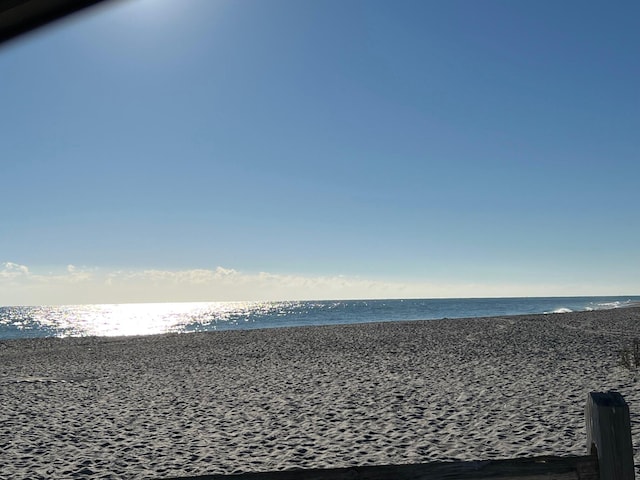 view of water feature with a beach view