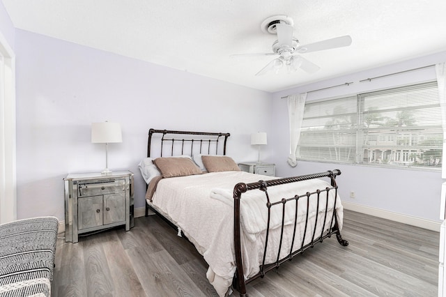 bedroom featuring ceiling fan and hardwood / wood-style floors