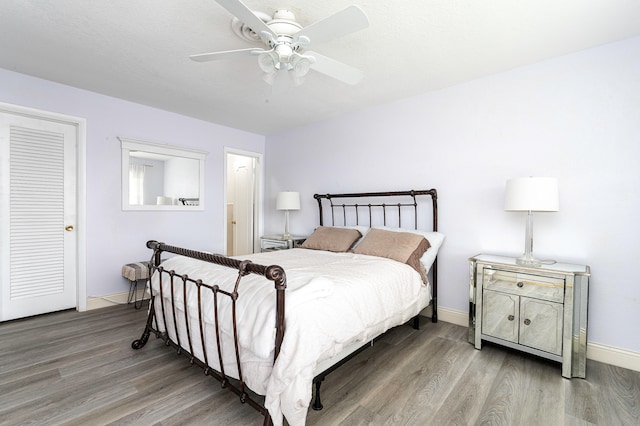 bedroom with hardwood / wood-style flooring and ceiling fan