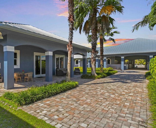 exterior space featuring an outdoor living space and a patio