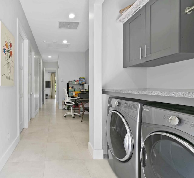 laundry room featuring independent washer and dryer and light tile patterned floors