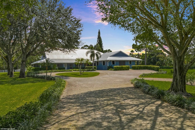 view of property's community with a yard