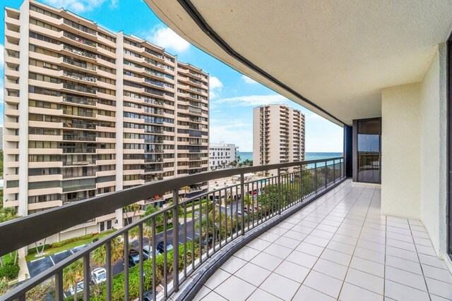 balcony featuring a water view