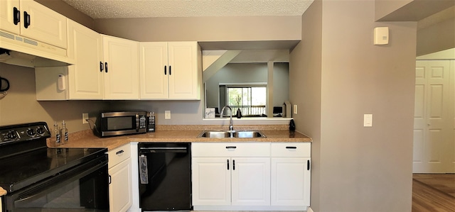 kitchen featuring white cabinets, sink, and black appliances