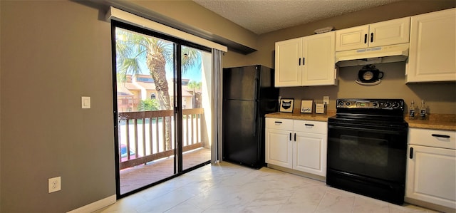 kitchen featuring black appliances, white cabinets, and a textured ceiling