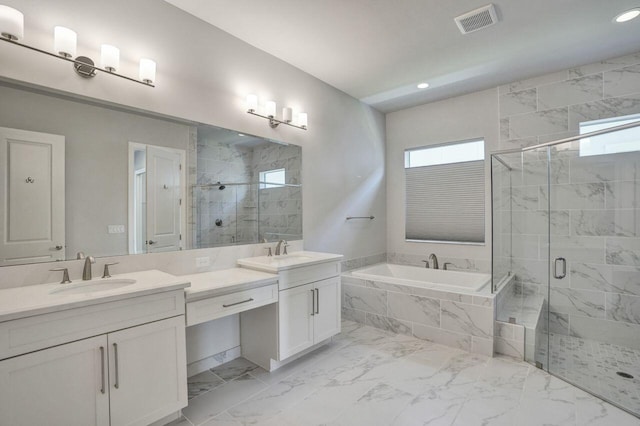 bathroom featuring separate shower and tub and vanity