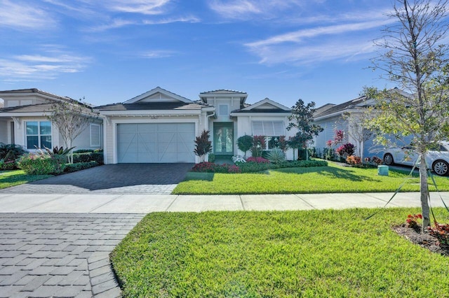 view of front facade featuring a front yard and a garage