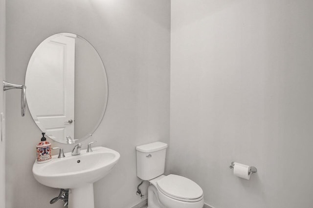 bathroom featuring sink and toilet