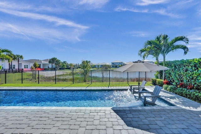 view of swimming pool featuring a water view