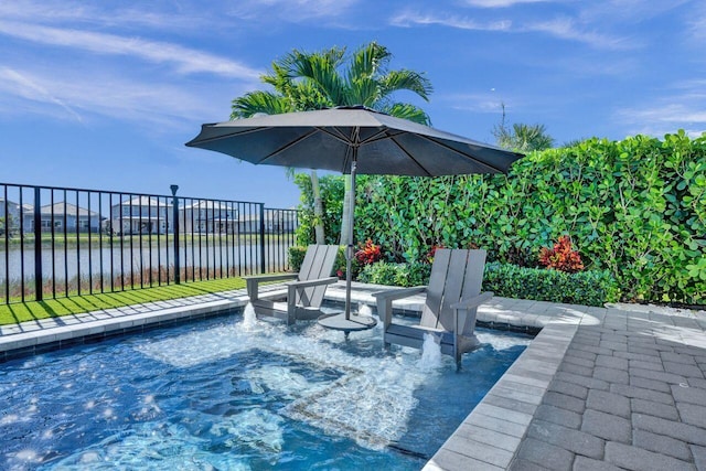 view of swimming pool featuring a jacuzzi and a water view