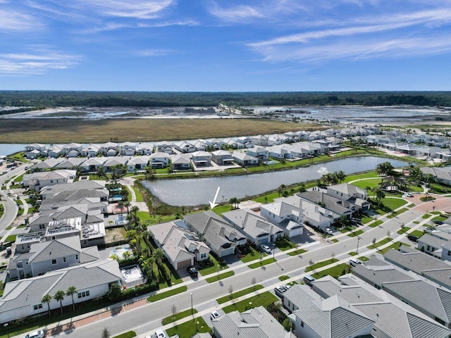 drone / aerial view with a water view