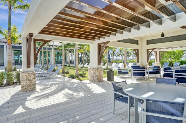 view of patio featuring ceiling fan