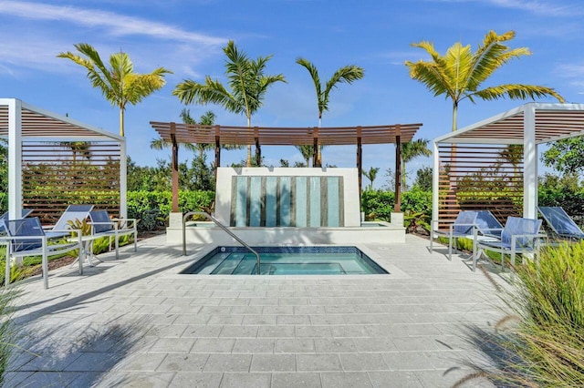 view of pool with a pergola, a patio area, and an in ground hot tub