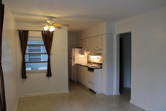 kitchen with ceiling fan, sink, white appliances, and white cabinetry